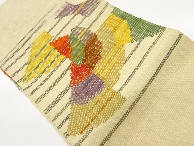 手織り真綿紬縞に抽象模様織出し名古屋帯